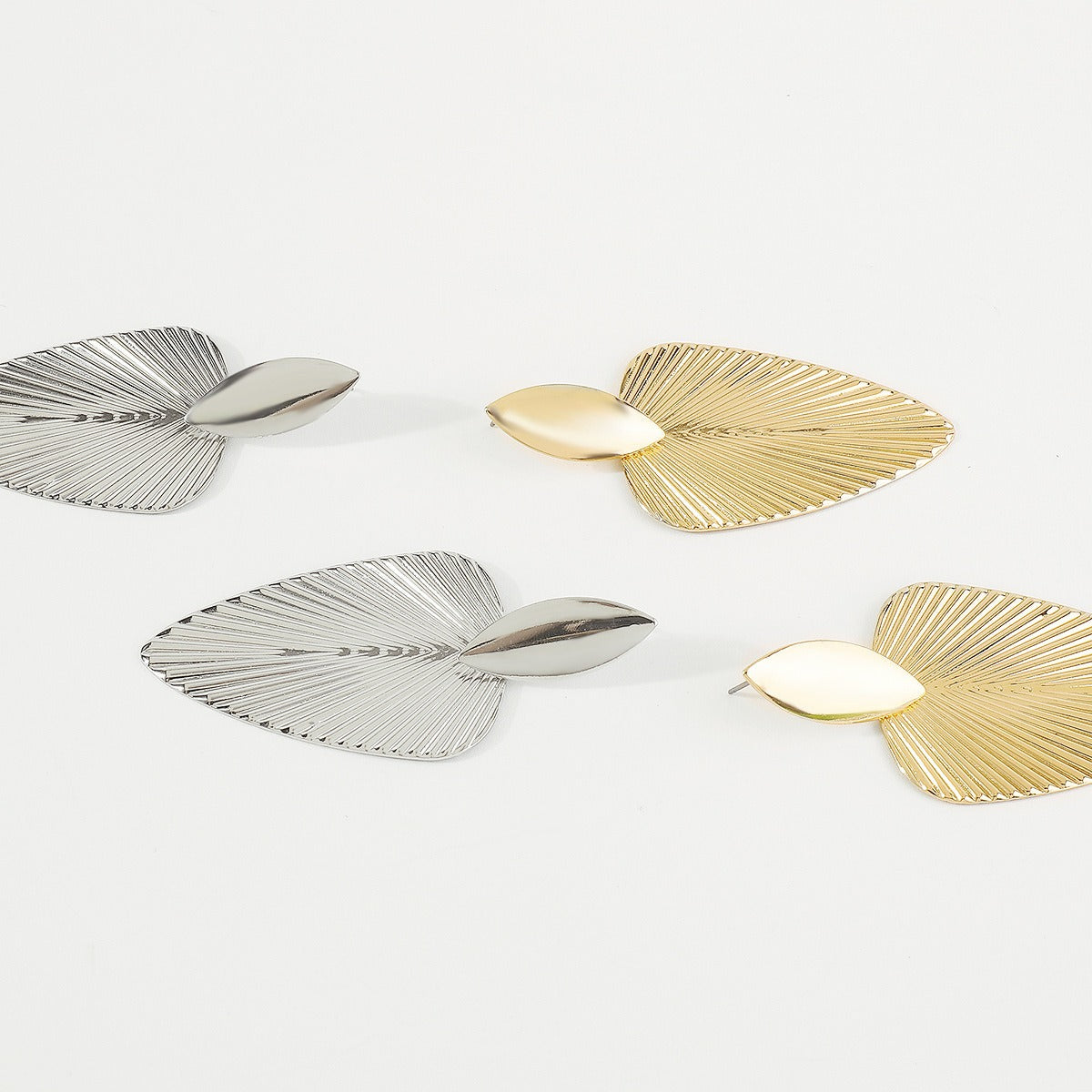 Metallic cattail leaf earrings