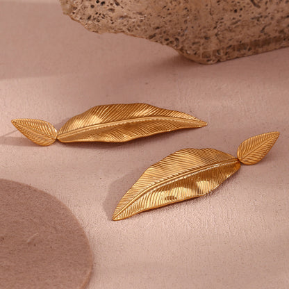 Gold spliced leaf earrings