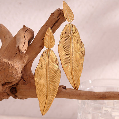 Gold spliced leaf earrings