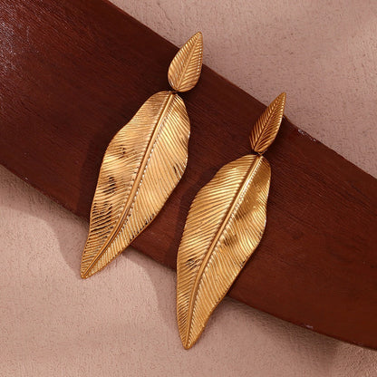 Gold spliced leaf earrings