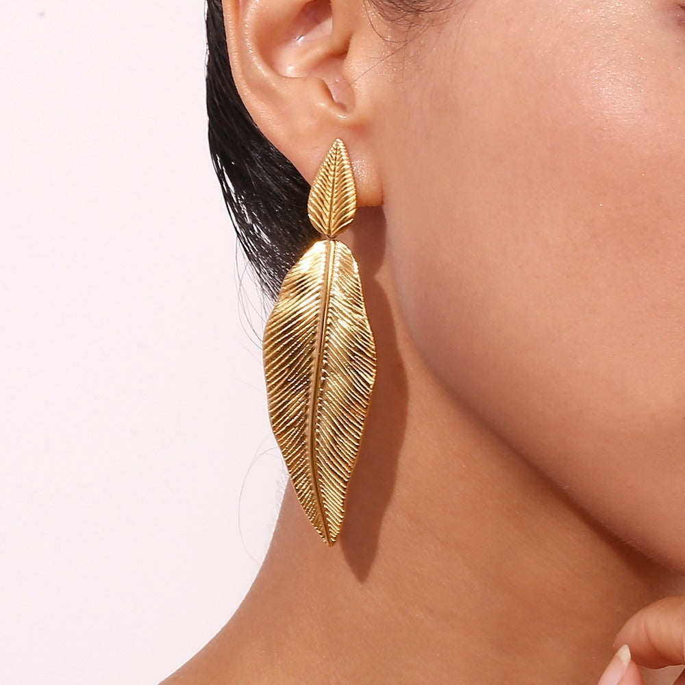 Gold spliced leaf earrings